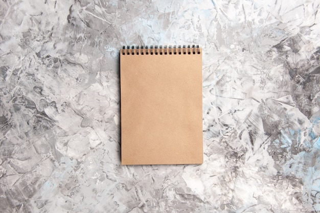 Top view basic notepad on white table copybook notepad