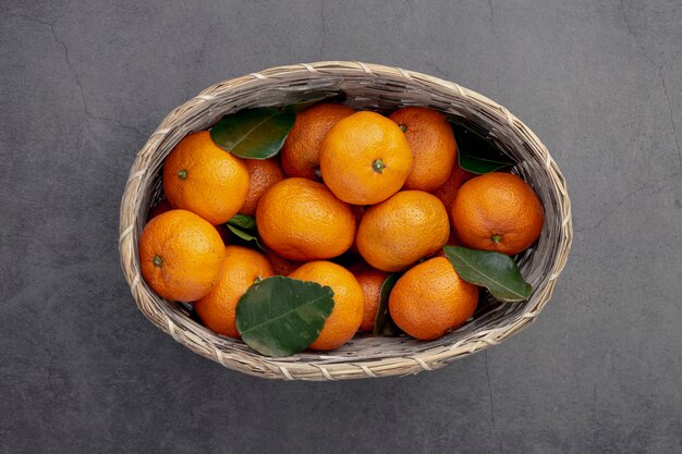 Top view of basket of tangerines