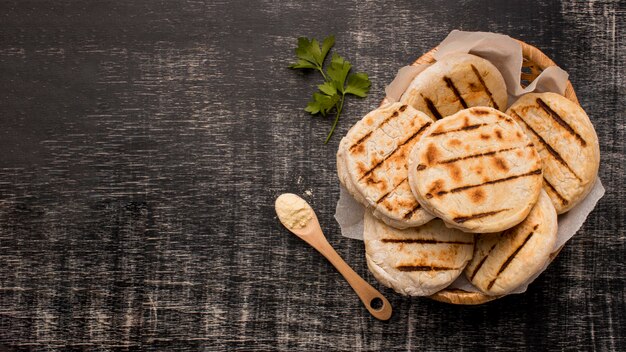 Top view basket with arepas and copy-space