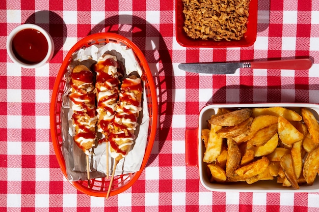 Top view basket with corn dogs and fries