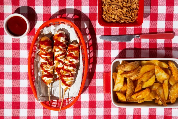 Top view basket with corn dogs and fries