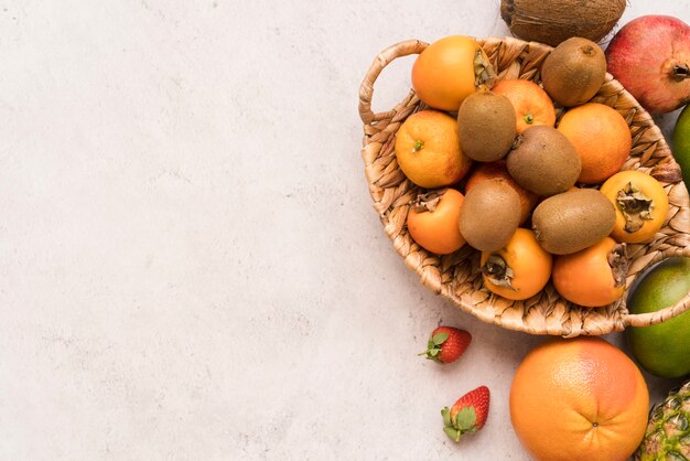 Top view basket with delicious fruits