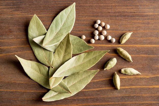 Top view of bay leaves with pepper