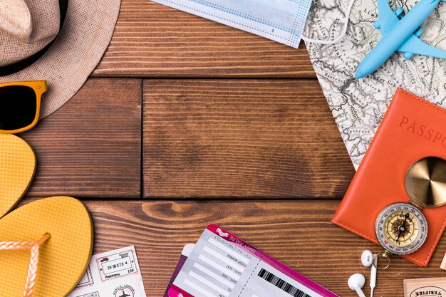 Top view beach slippers with world map and passport