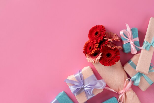 Top view of beautiful flowers bouquet with present