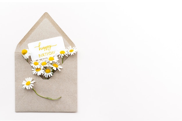 Free photo top view beautiful flowers in envelope