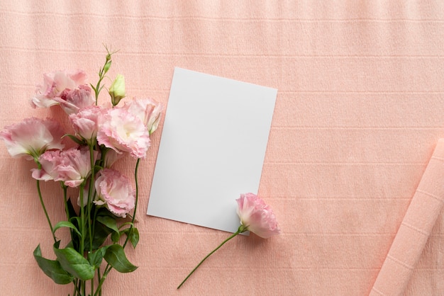Top view of beautiful roses with blank card