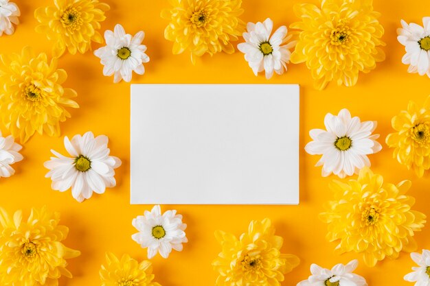 Top view beautiful spring flowers composition with empty card