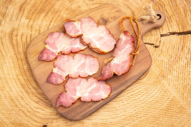 Top view becon slices on chopping board