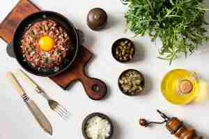 Free photo top view beef steak tartar still life