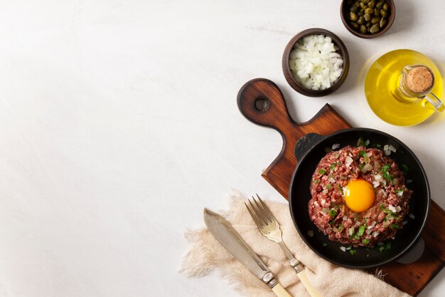 Top view beef steak tartar still life