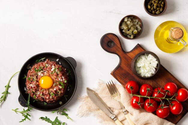 Top view beef steak tartar still life