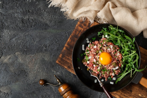 Top view beef steak tartar still life