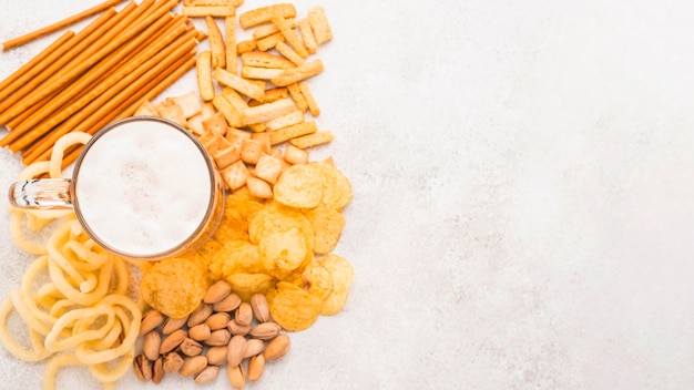 Top view beer mug on snacks