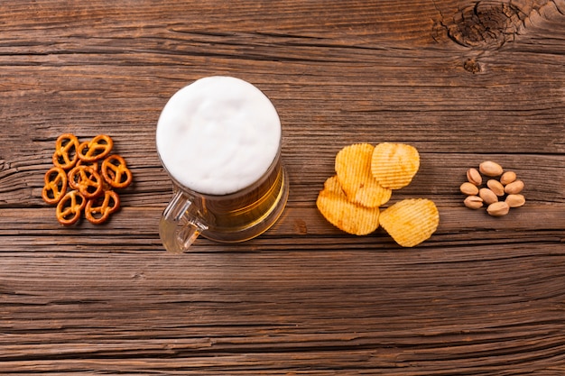 Top view beer mug with snacks