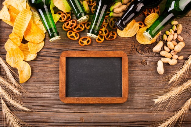 Top view beer with snacks and chalkboard