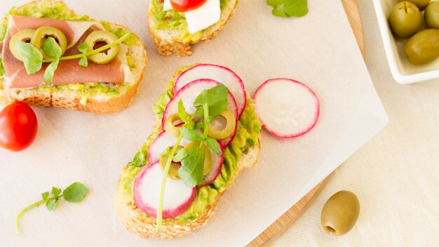 Top view beetroot and olives sandwiches