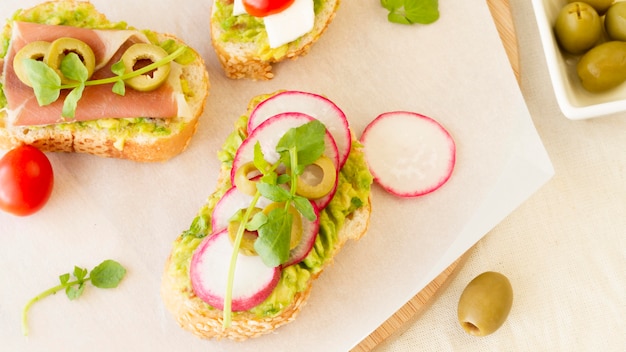 Top view beetroot and olives sandwiches