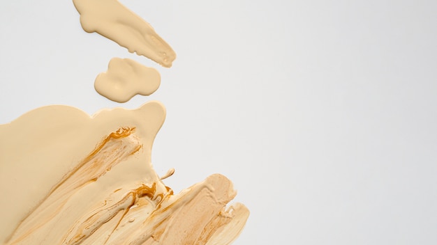 Free photo top view beige foundation with copy space