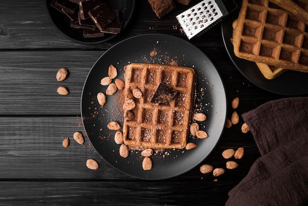 Free photo top view belgian waffle with almonds