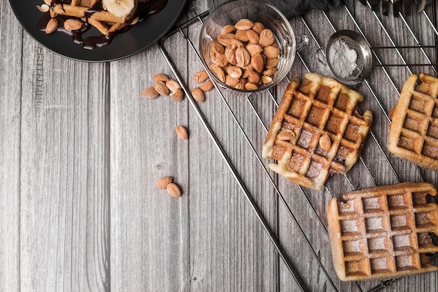 Free photo top view belgian waffle with almonds