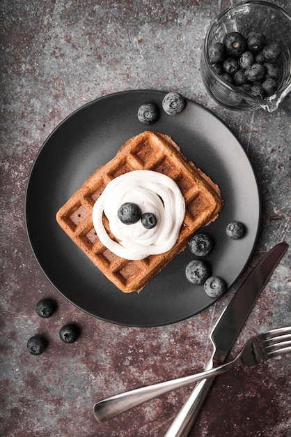 Top view belgian waffle with blueberries