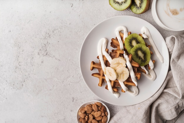 Top view belgian waffle with fruits