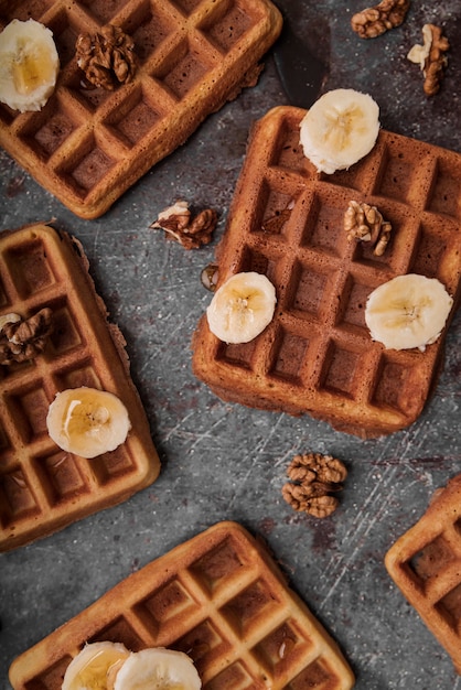 Free photo top view belgian waffles with banana