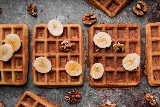 Top view belgian waffles with banana