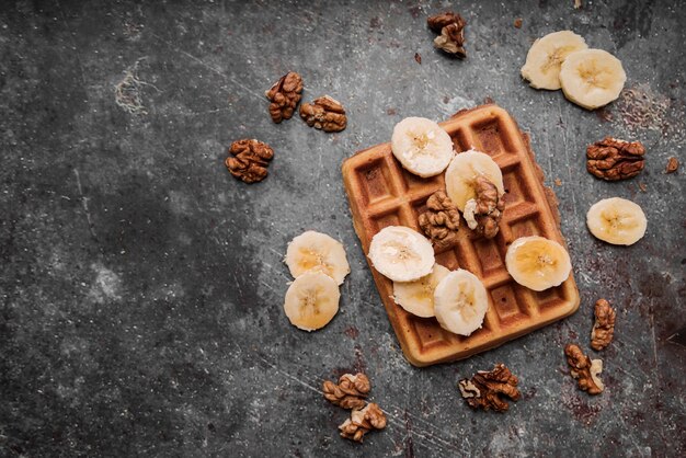 Top view belgian waffles with banana