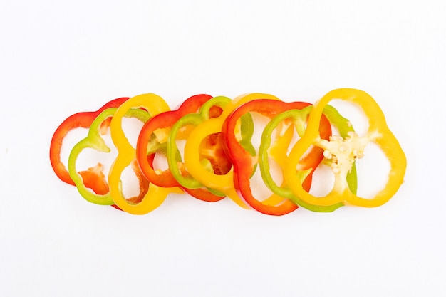 Free photo top view bell pepper pepper sliced on white  horizontal