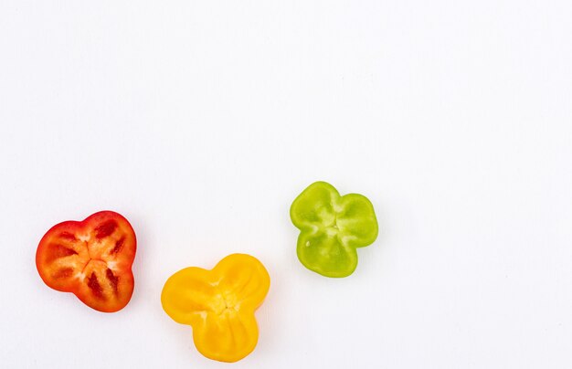 Top view bell pepper pepper sliced with copy space on white  horizontal