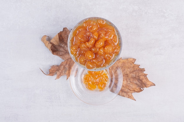 Top view of berry jam on white surface.