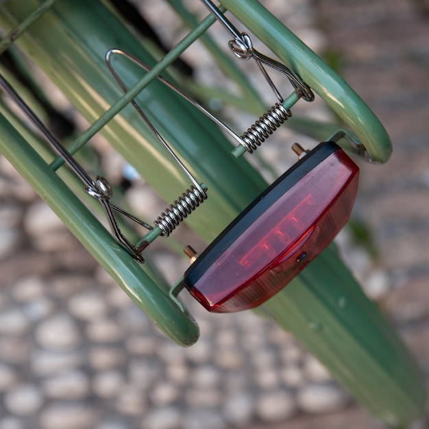 Top view of bicycle with light and defocused pavement