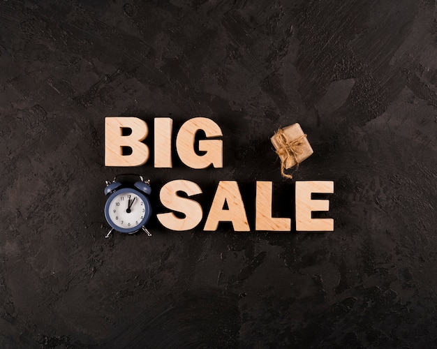 Top view of big sale word on plain background
