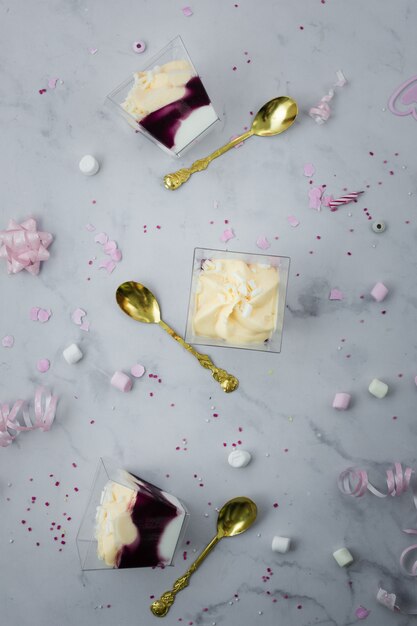 Top view of birthday cake and golden cutlery