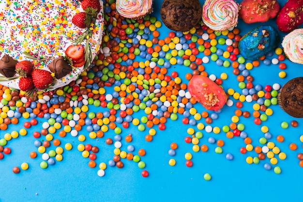 Top view birthday cake with pastries