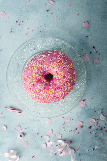 Top view of birthday doughnut with sprinkles