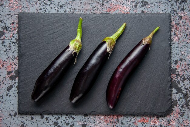 top view black eggplants on cutting board blue surface lunch salad ripe color meal food