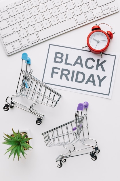 Top view black friday shopping carts and keyboard