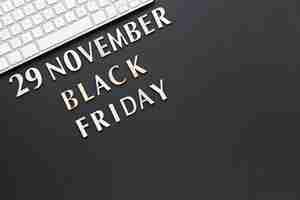 Free photo top view black friday text near keyboard