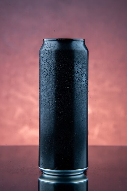 Top view of black iron bottle standing on dark background