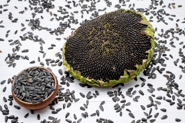 A top view black sunflower seeds fresh and tasty inside shell grain sunflower seed snacks
