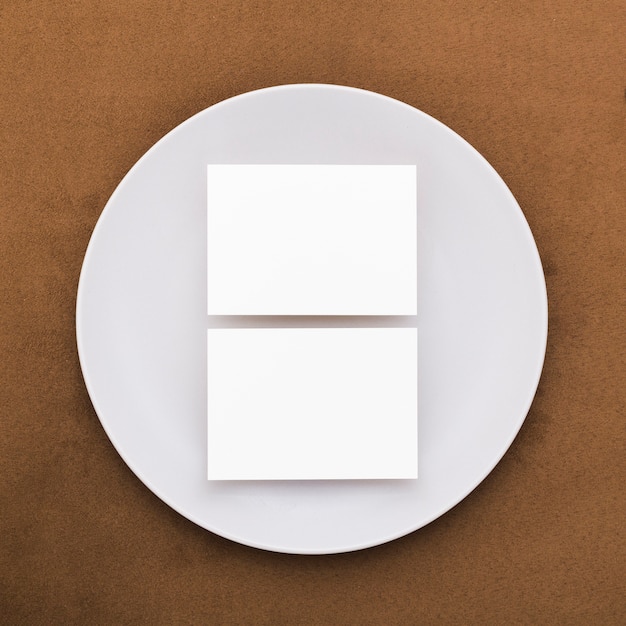 Top view blank business cards on a plate