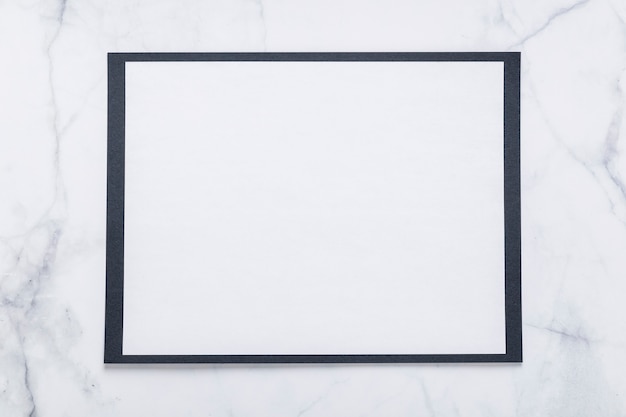 Top view of blank menu paper on marble surface