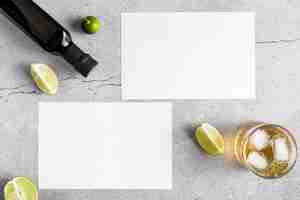 Free photo top view of blank menu papers with olive oil and drink