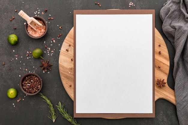 Top view of blank menu with lime and condiments