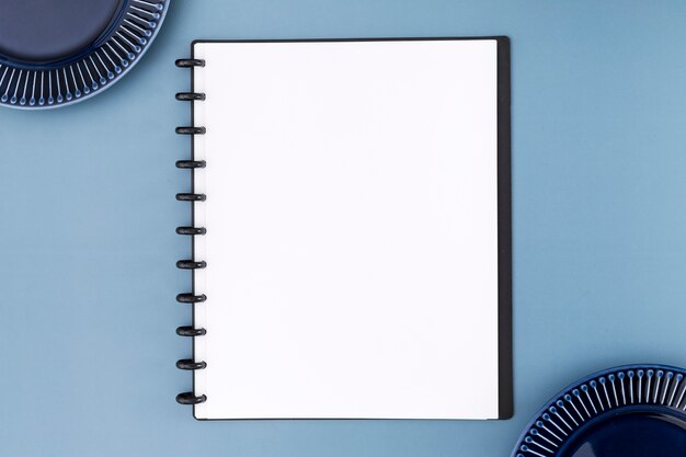 Top view of blank notebook menu with plates