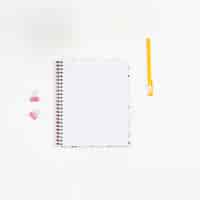 Free photo top view blank notebook with white background