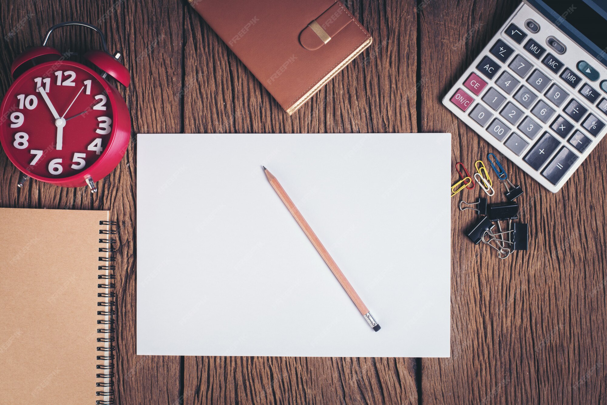 Free Photo | Top view blank white paper on wood desk workspace